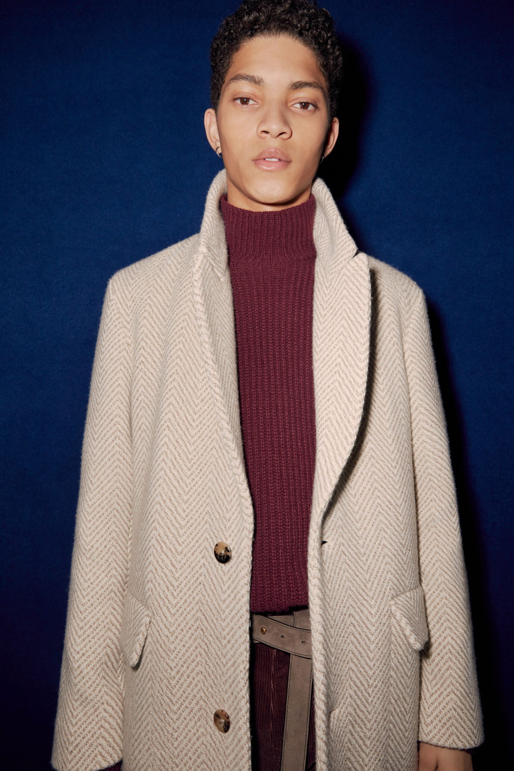 beige wool coat with burgundy sweater