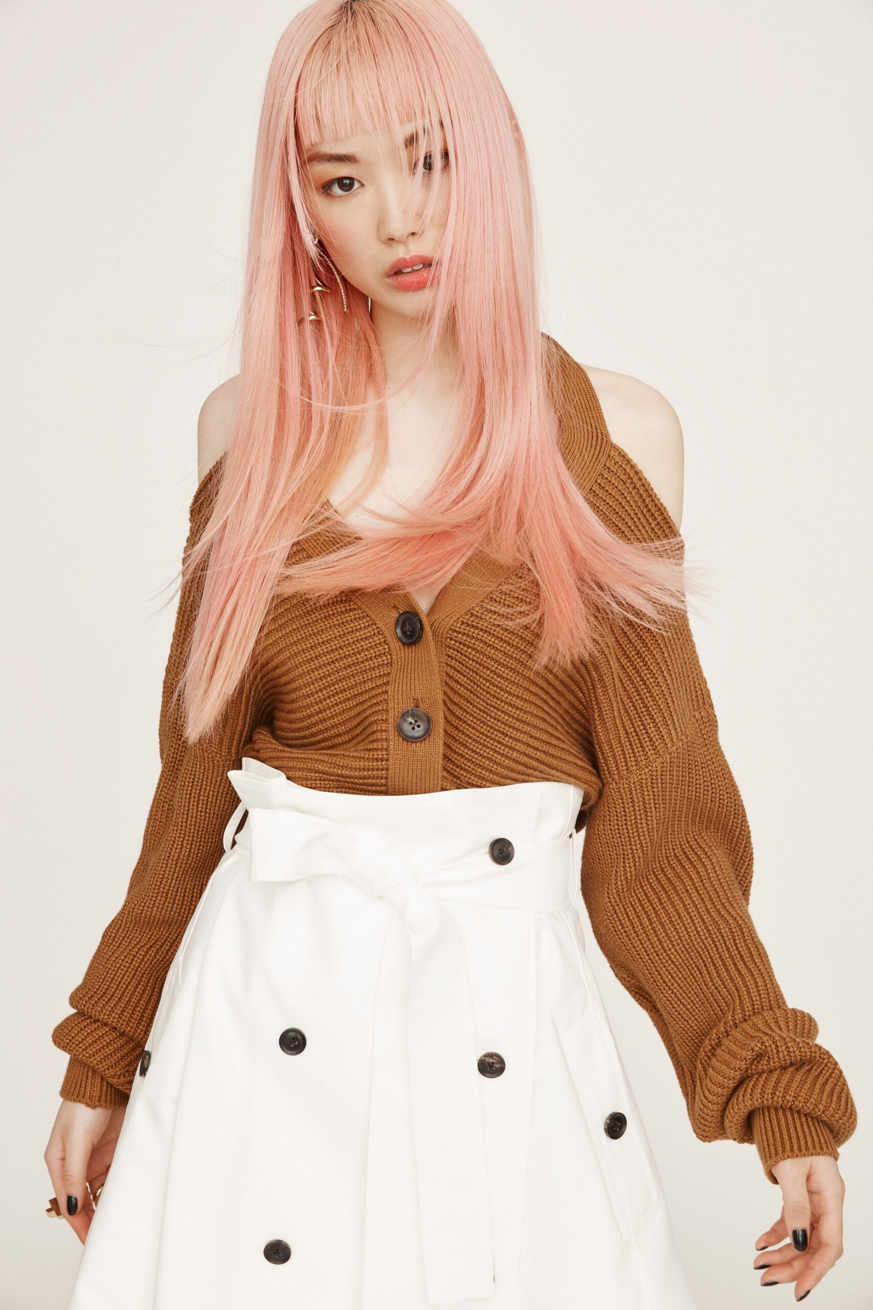 brown relaxed top with white skirt