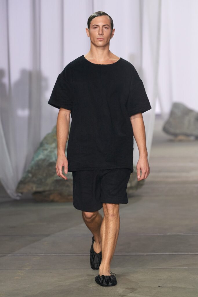 A relaxed black cotton t-shirt paired with matching shorts for a casual look.