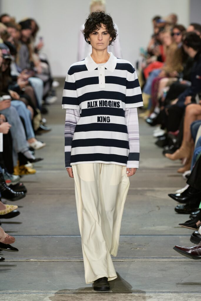 A relaxed-fit striped shirt with short sleeves paired with loose-fitting pants.