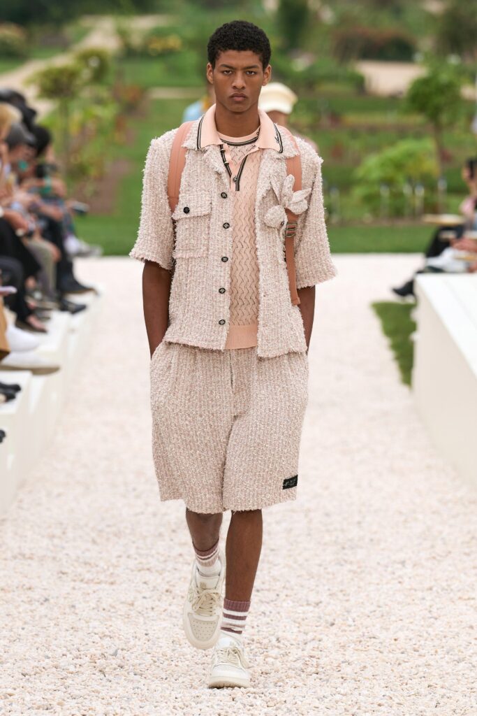 A relaxed beige cotton jacket with short sleeves paired with matching shorts, featuring a textured design.