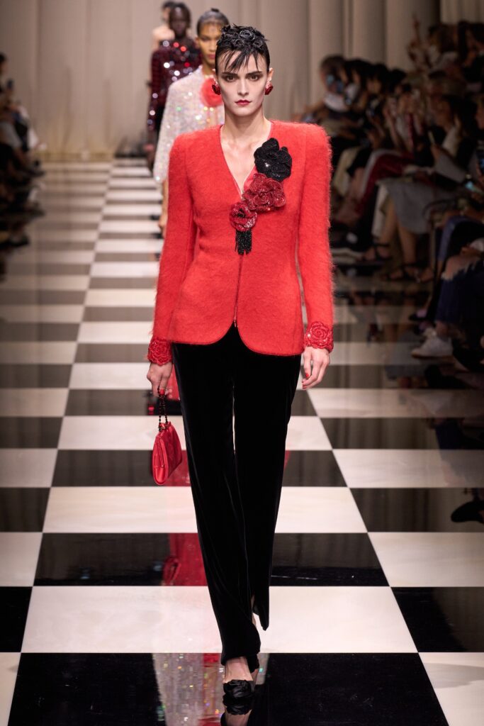 red tailored blazer with black pants
