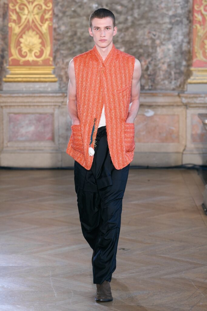 orange cotton sleeveless vest and black pants