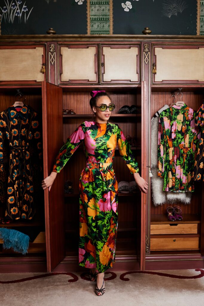 A fitted multicolor dress with long sleeves and a flared silhouette.