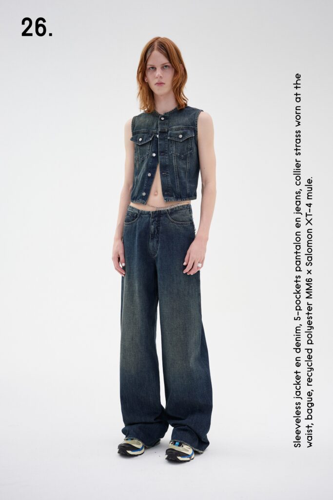 A relaxed fit blue denim sleeveless vest paired with high-waisted wide-leg pants.