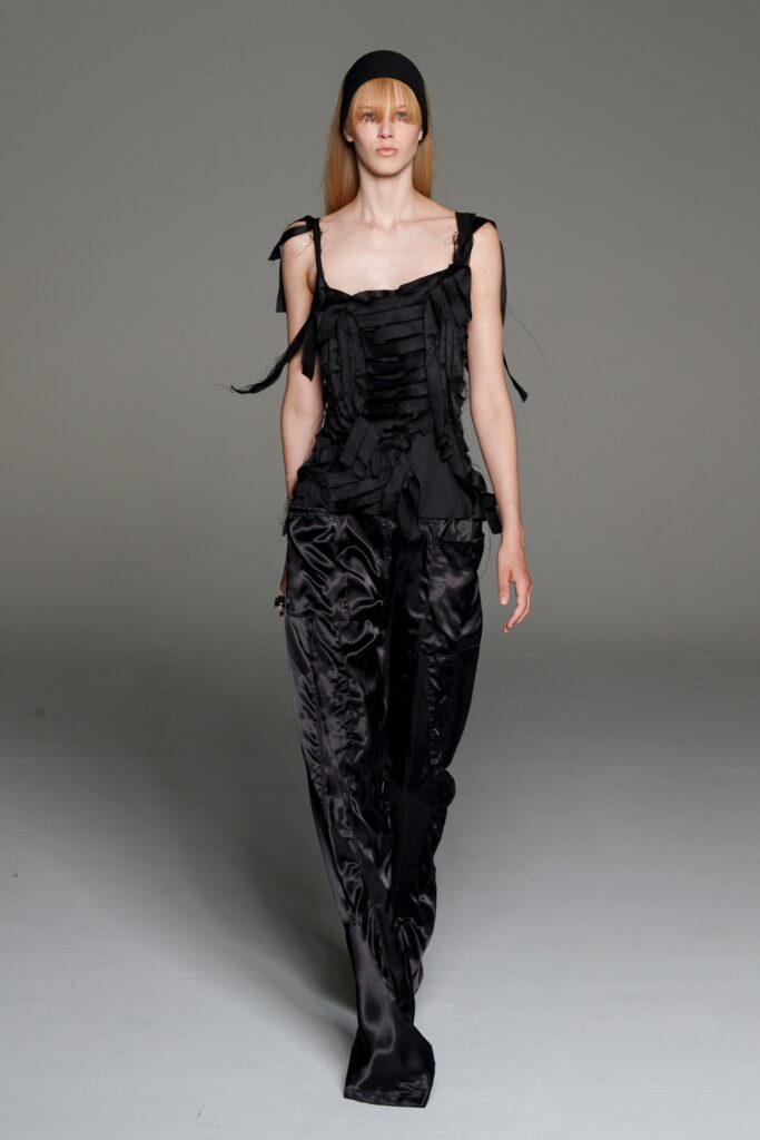 black silk fitted top and relaxed pants
