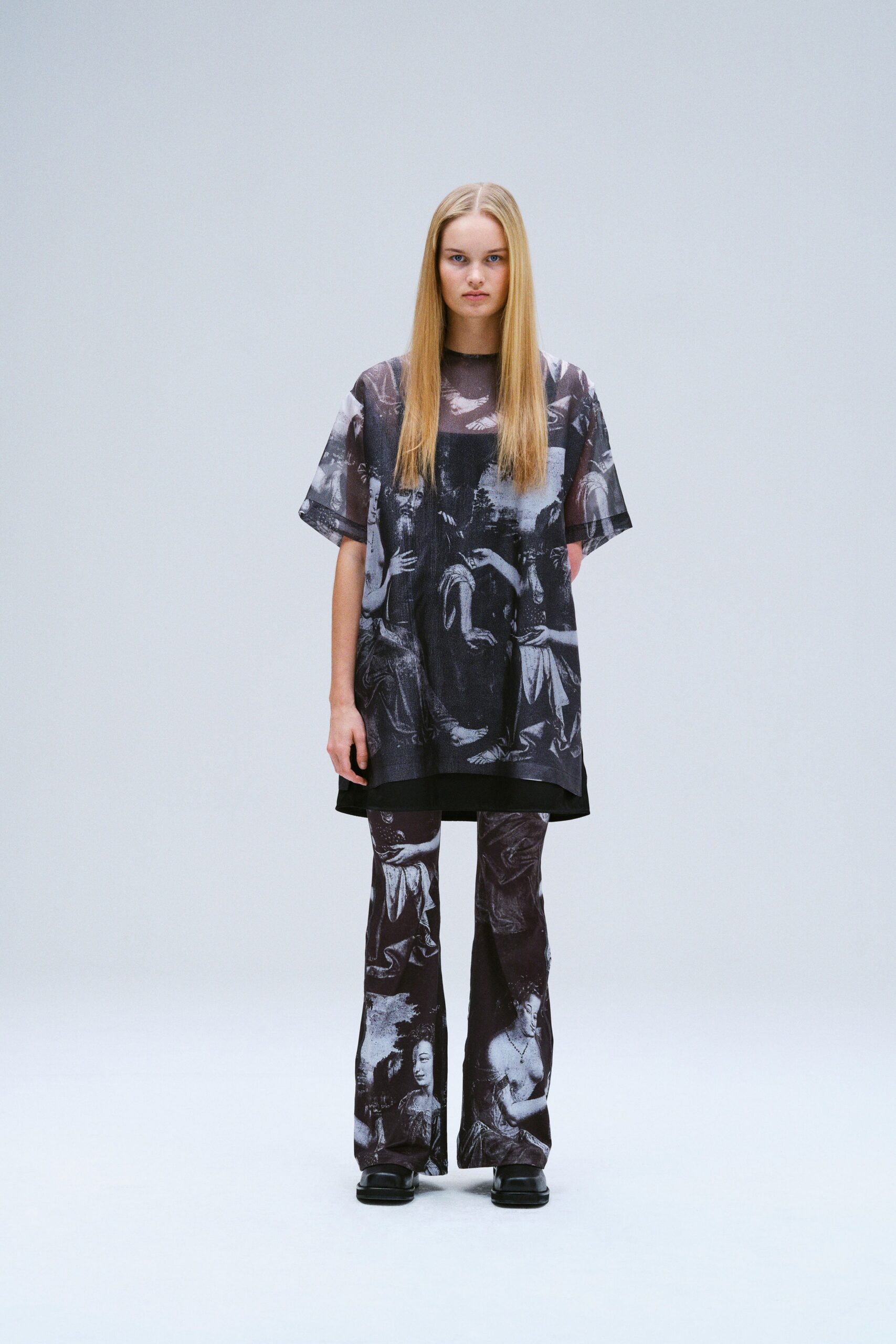 A relaxed black and white printed top with short sleeves paired with matching printed pants.