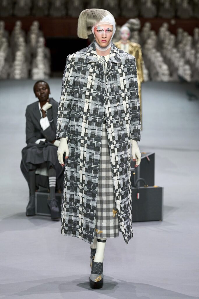 checked coat and pleated dress