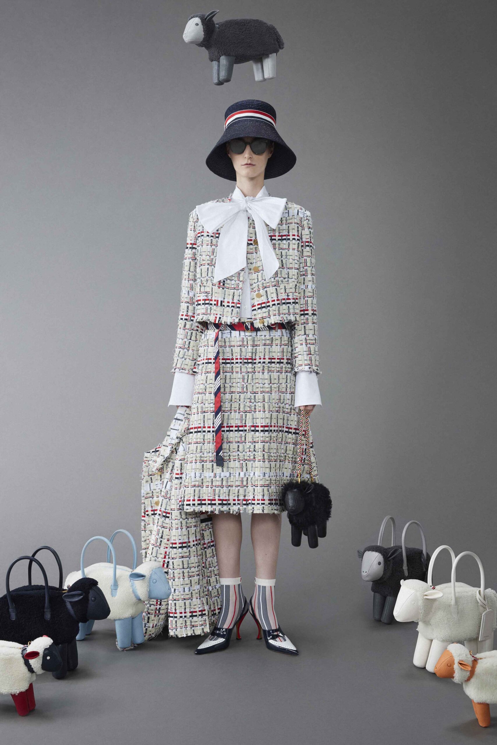 A relaxed multicolor tweed dress with long sleeves and a collared neckline featuring an asymmetric silhouette.