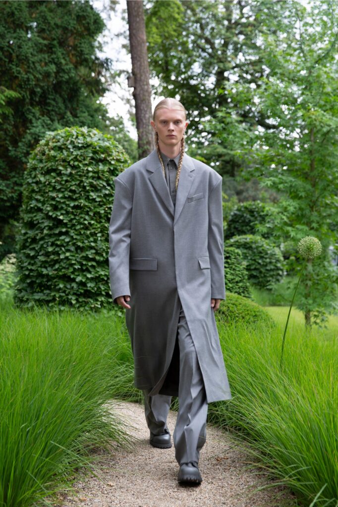 A relaxed gray coat paired with matching pants featuring a long-sleeve and collared design.