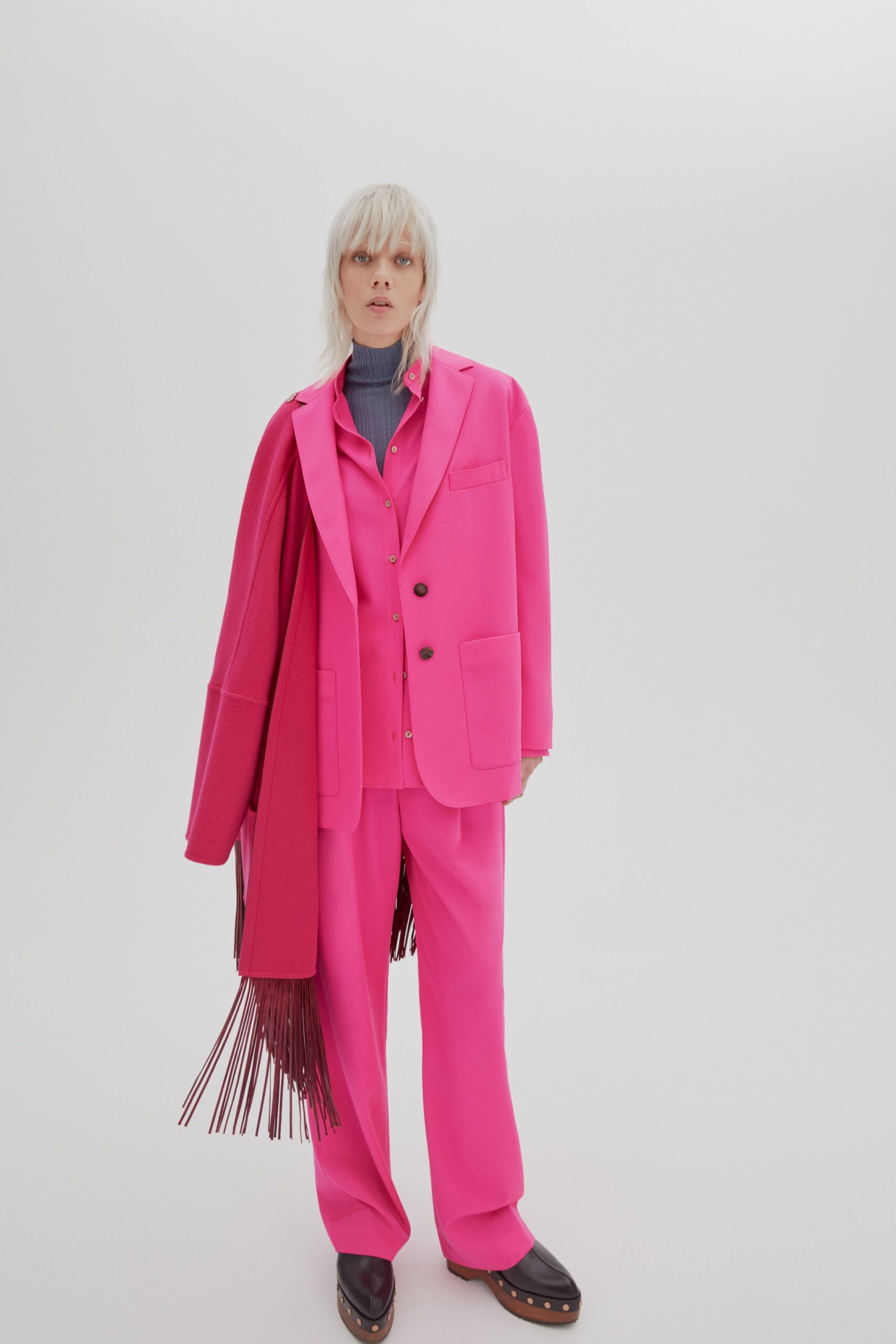 pink tailored suit with scarf