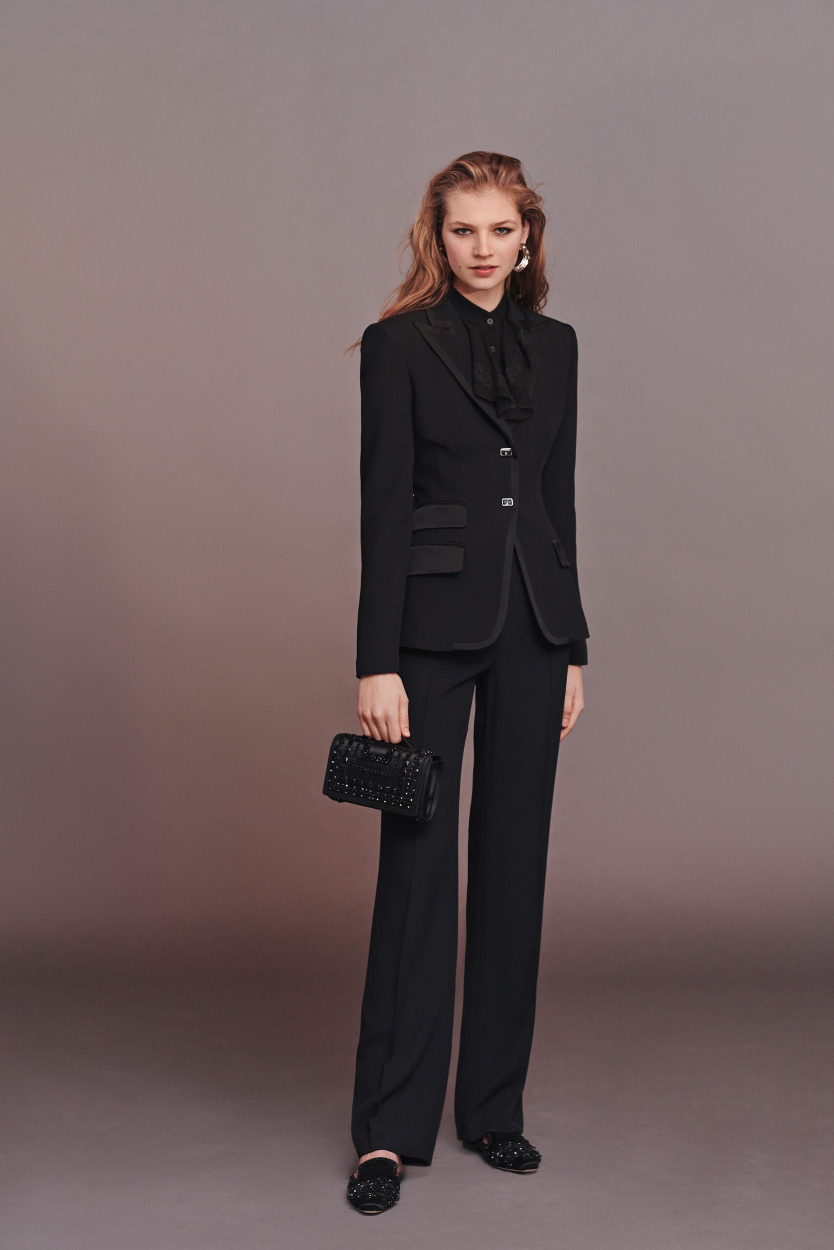 black tailored suit with clutch