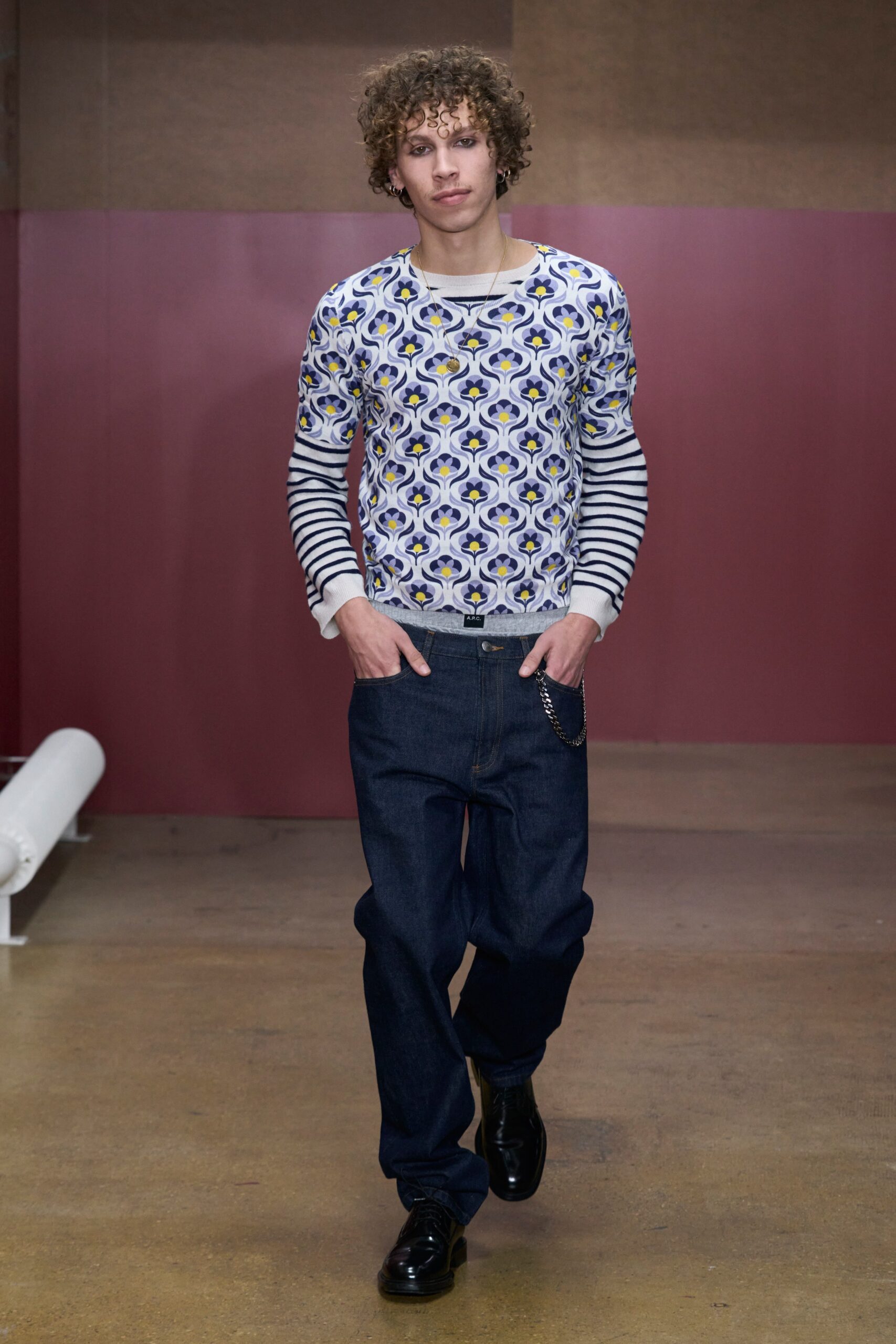A relaxed-fit striped printed shirt paired with blue denim jeans.