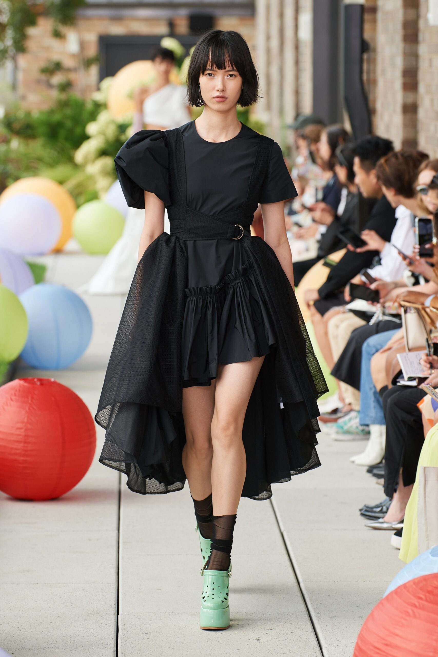 black pleated mini dress with green shoes