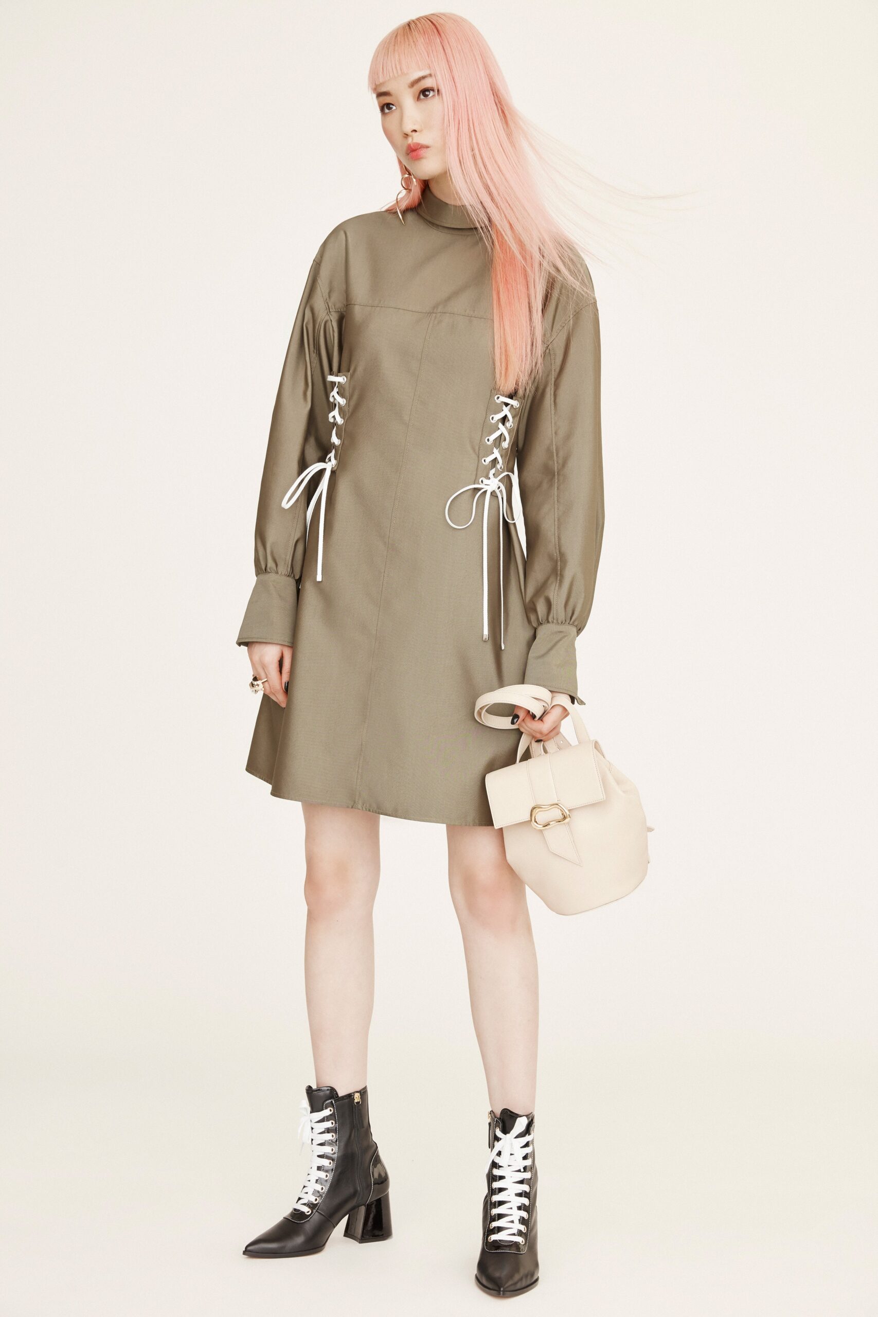 green fitted dress with boots