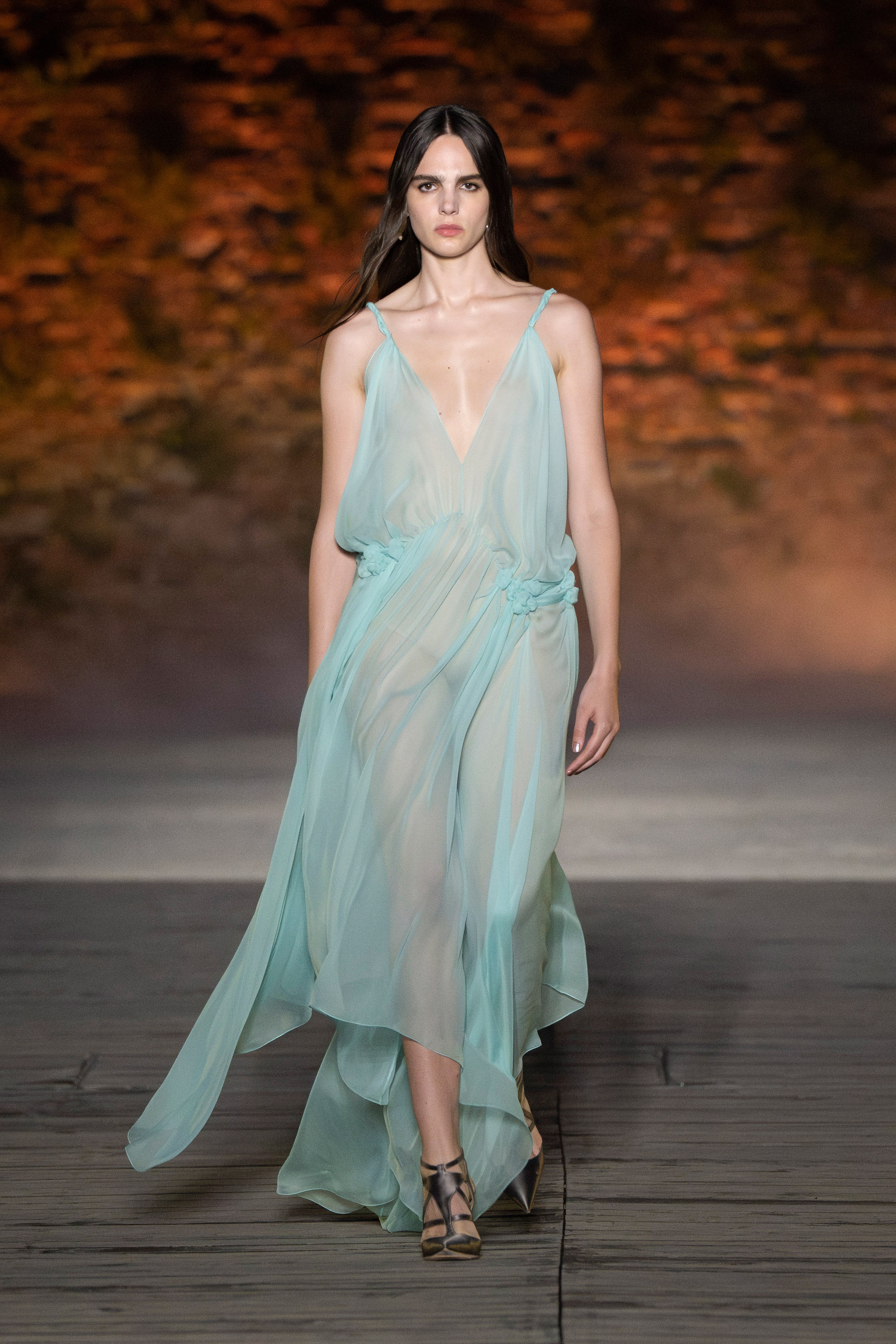 A relaxed blue chiffon sleeveless dress with a V-neckline and layered design.