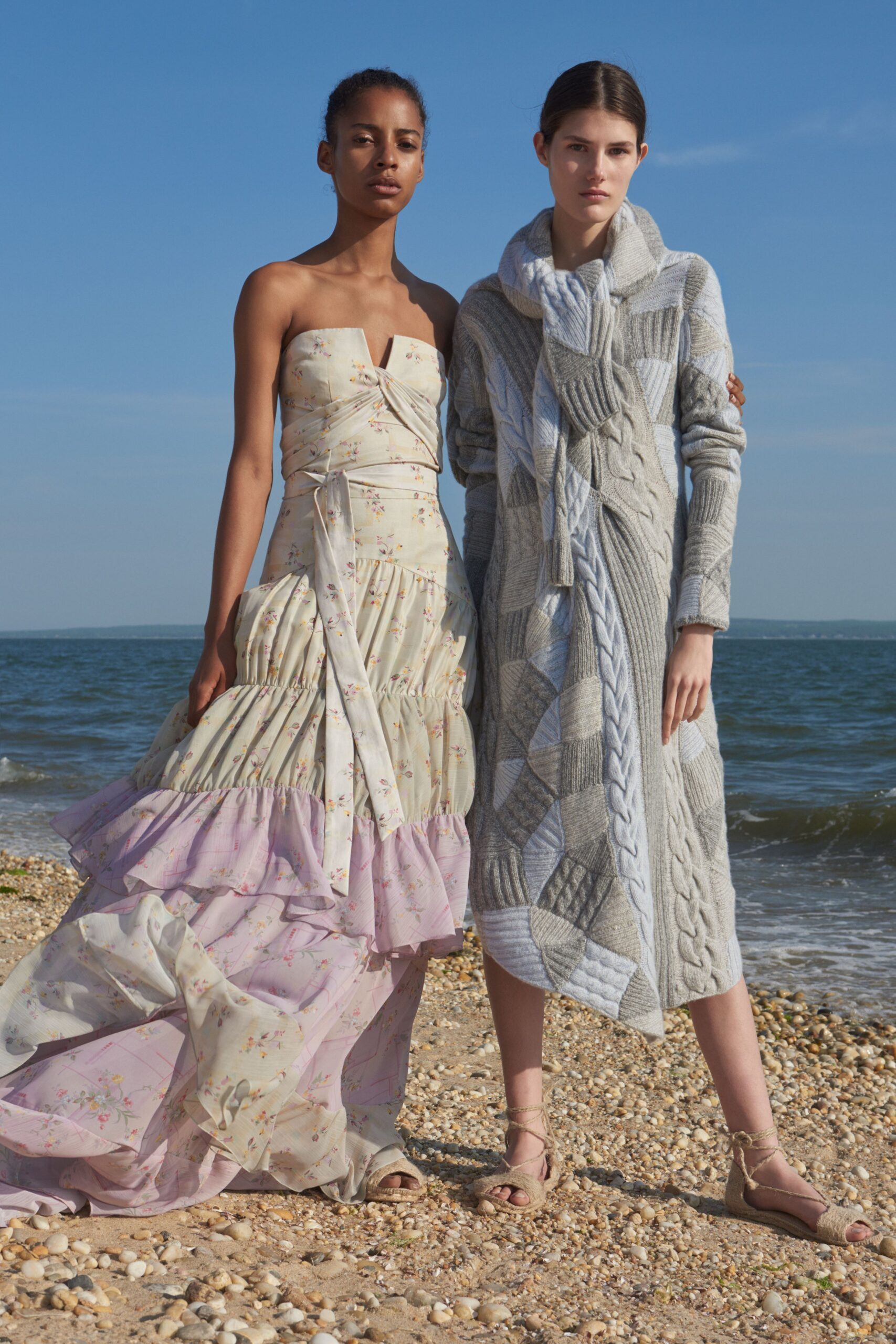 beige pink tiered gown and gray knit coat