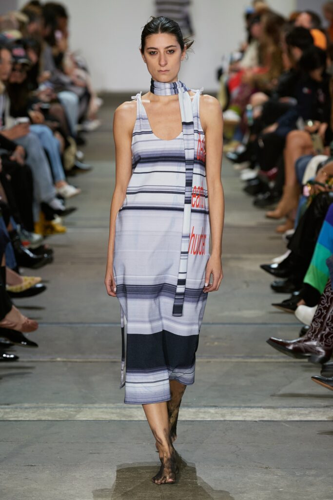 A relaxed blue printed sleeveless dress featuring a V-neckline.