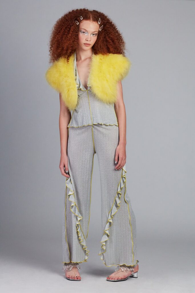 gray silk fitted jumpsuit with yellow faux-fur cape