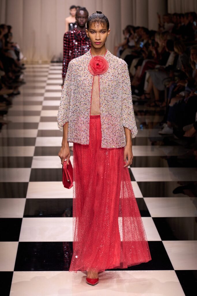 embroidered white top with red skirt