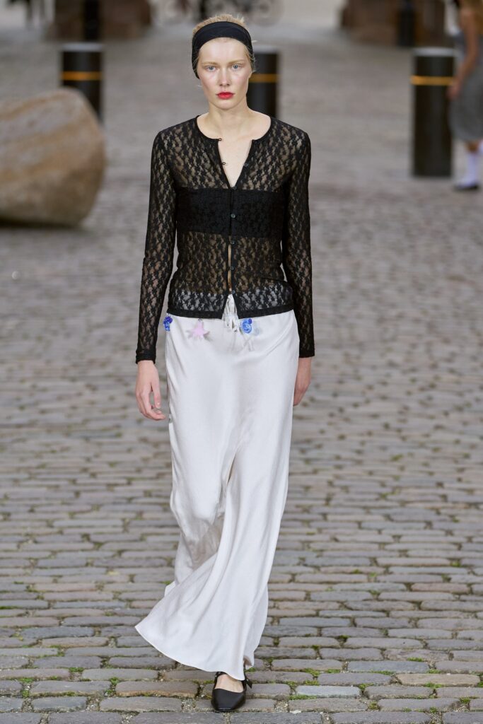 black lace cardigan and white silk skirt