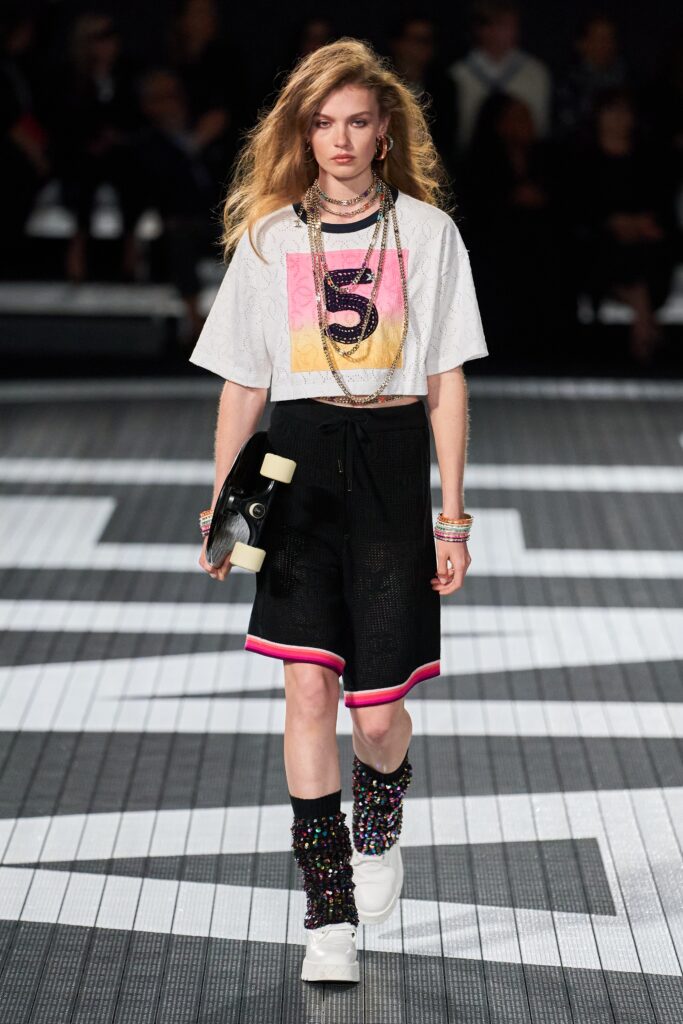 A relaxed fit black and white printed top paired with color-blocked shorts.