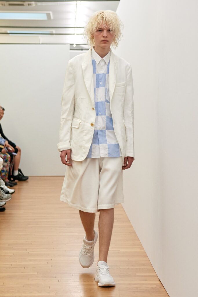 A relaxed-fit white cotton suit featuring a checked short-sleeve shirt and matching shorts.