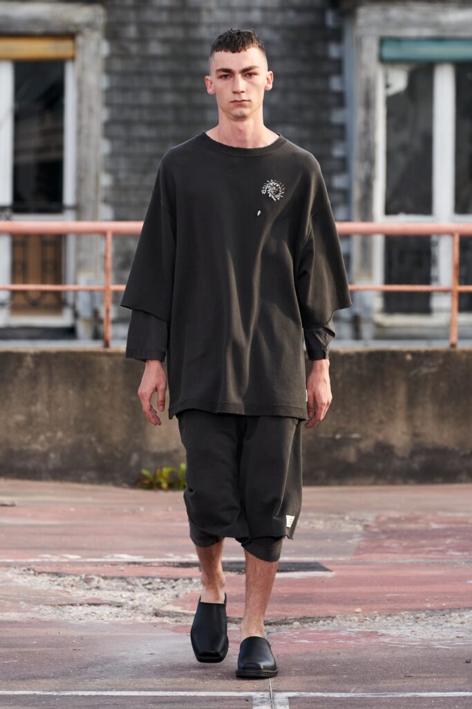 A relaxed black cotton top with long sleeves and asymmetric pants.