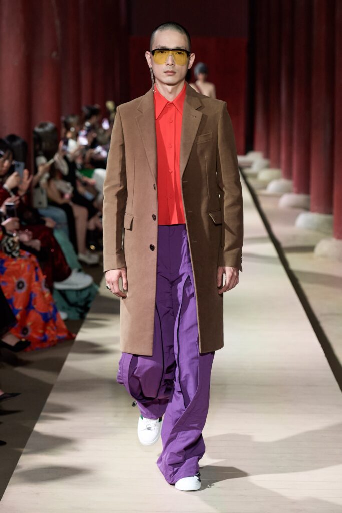 brown tailored coat with red shirt