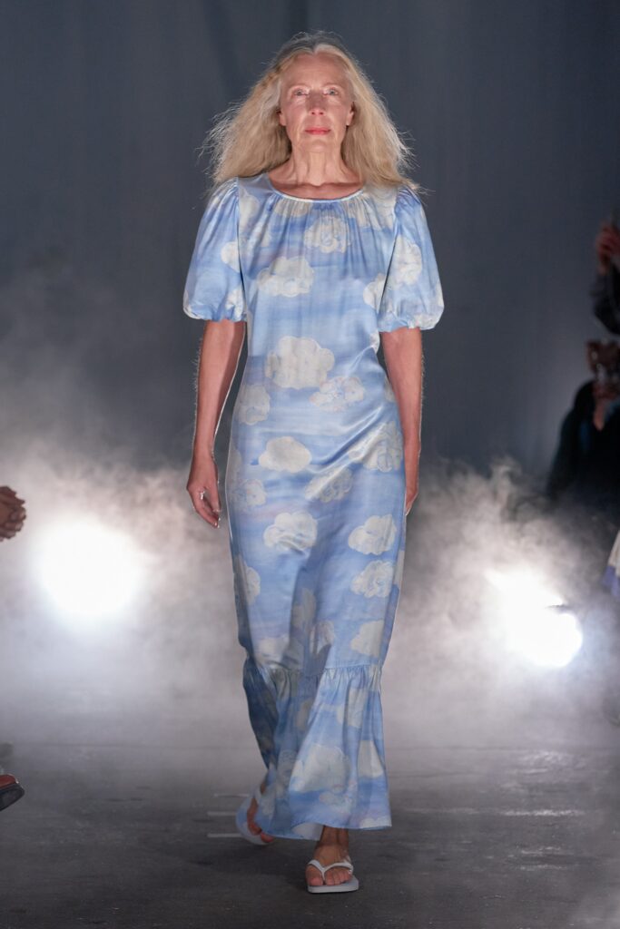 A relaxed blue cotton dress with short sleeves and a tiered design.