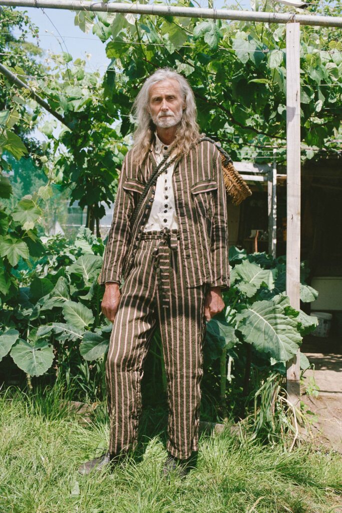 A relaxed brown and beige striped suit with a long-sleeve collared shirt.