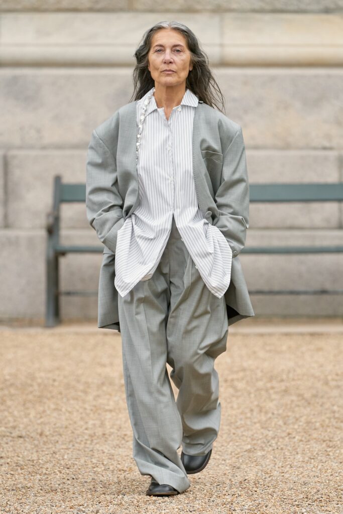 A relaxed gray striped blazer paired with matching pants for a chic look.