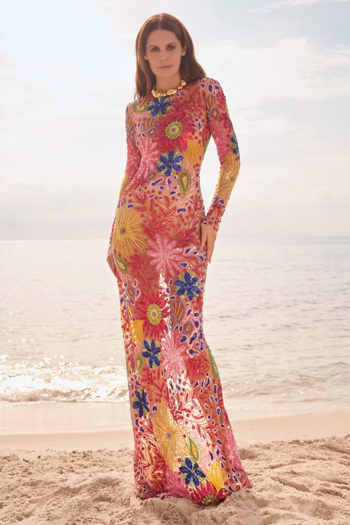 A fitted multicolor sheer long-sleeve dress with a V-neckline and flared silhouette.
