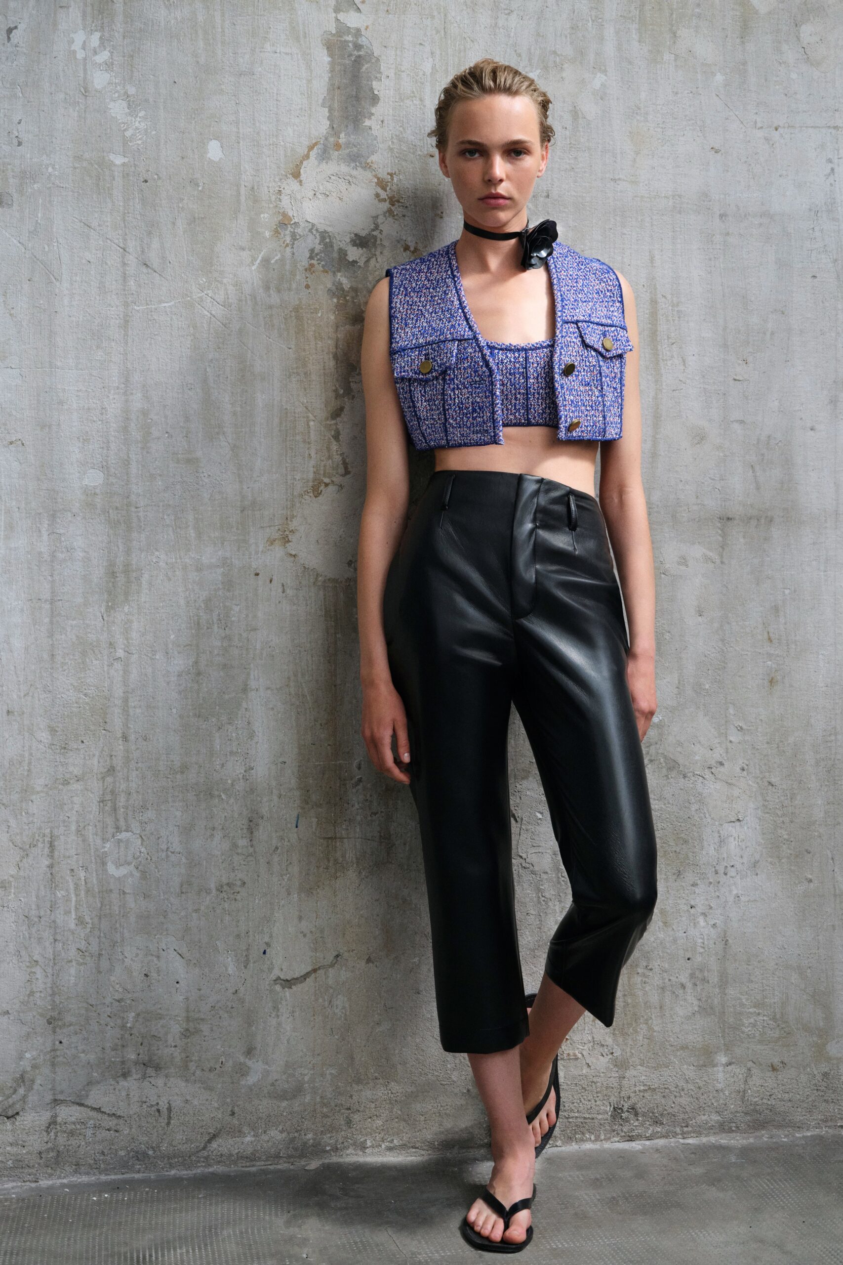 blue fitted top and black leather pants