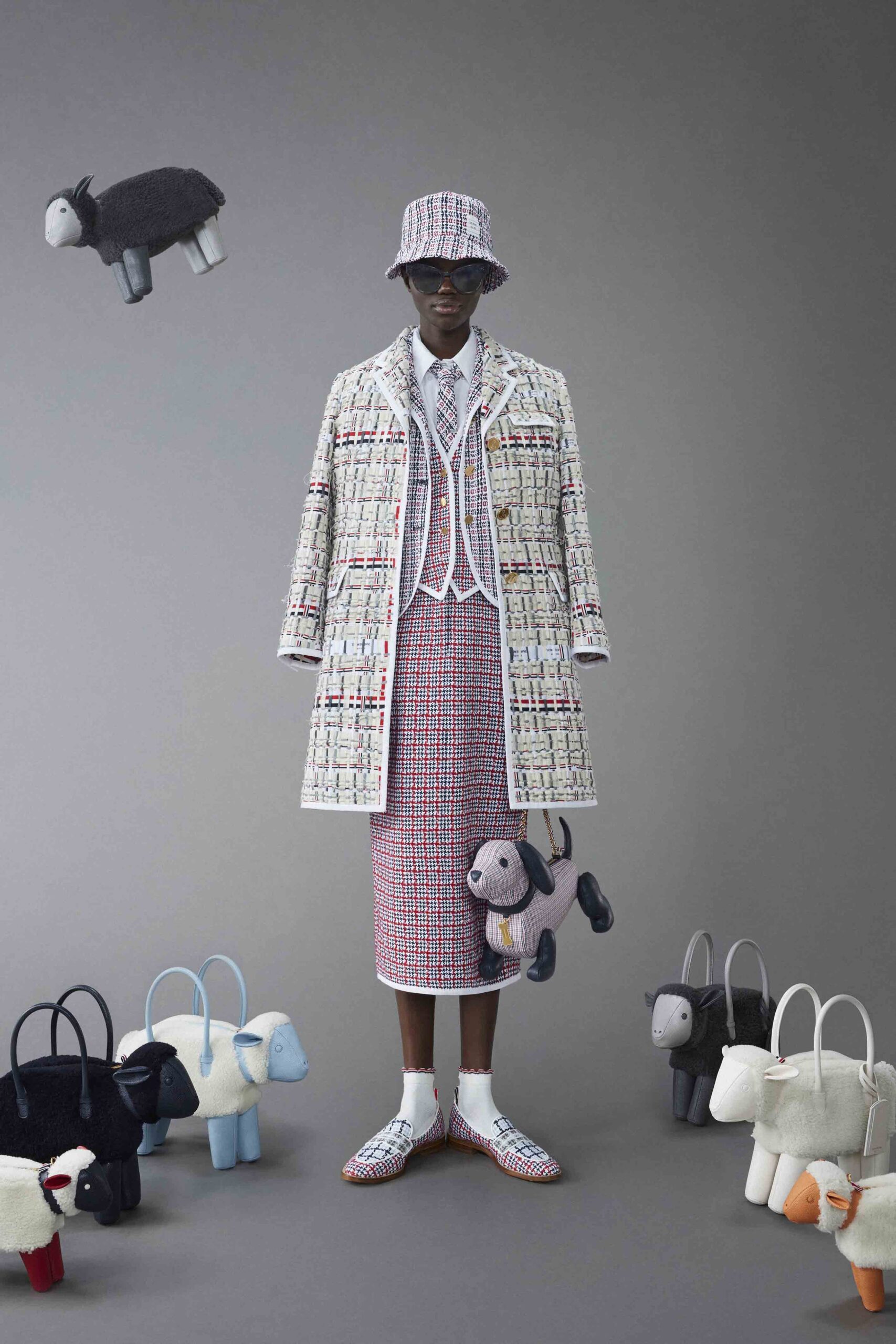 A relaxed-fit multicolor checked coat paired with a matching skirt, featuring a collared design.