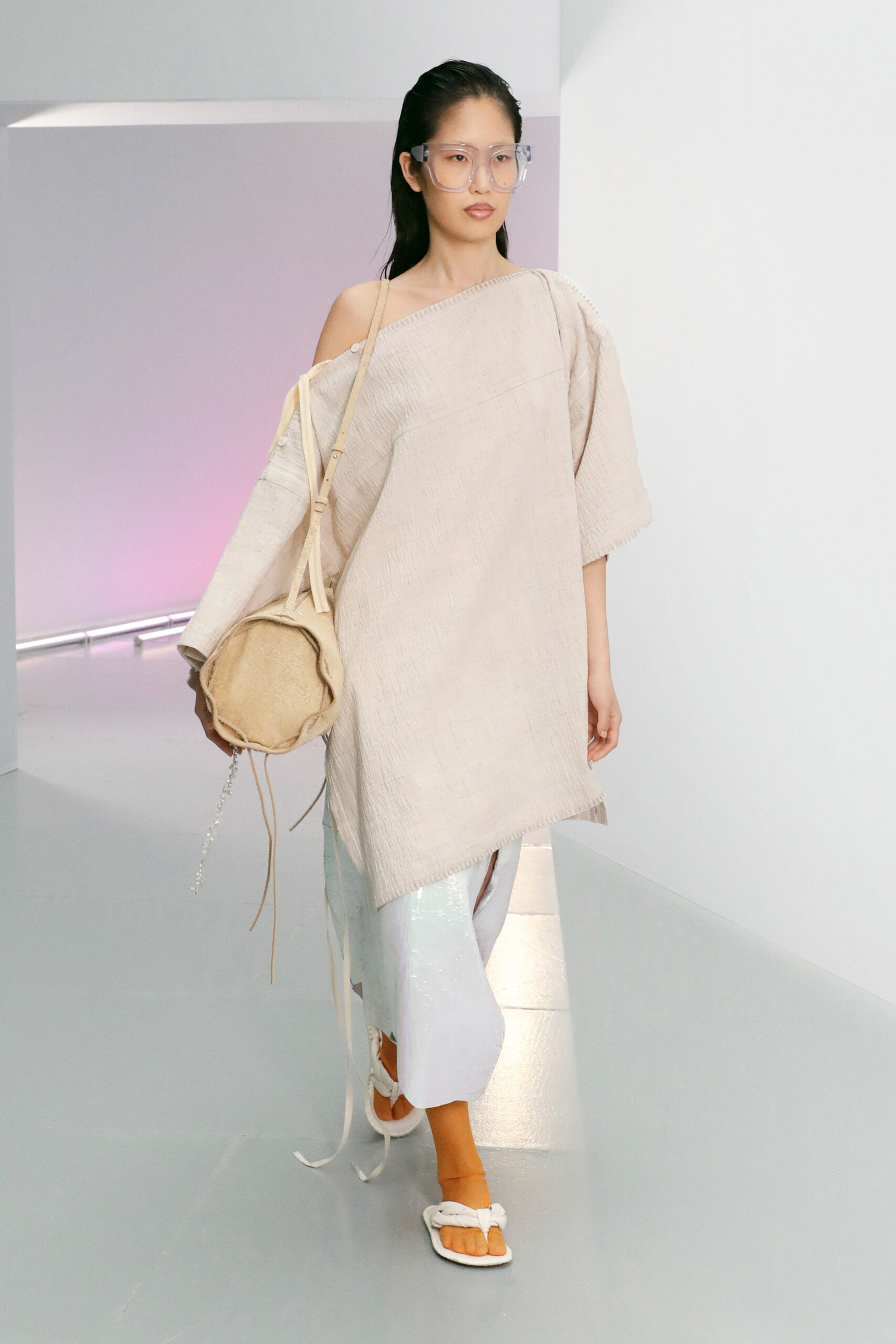 beige relaxed top with white pants