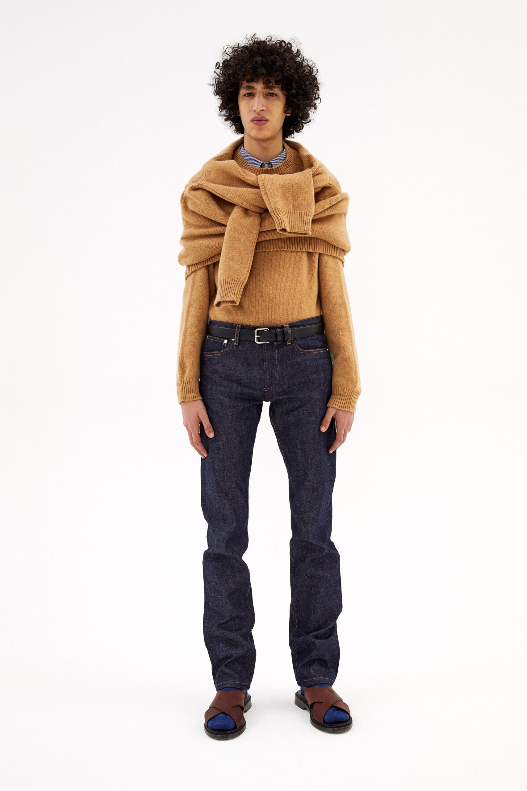 beige wool sweater with blue jeans