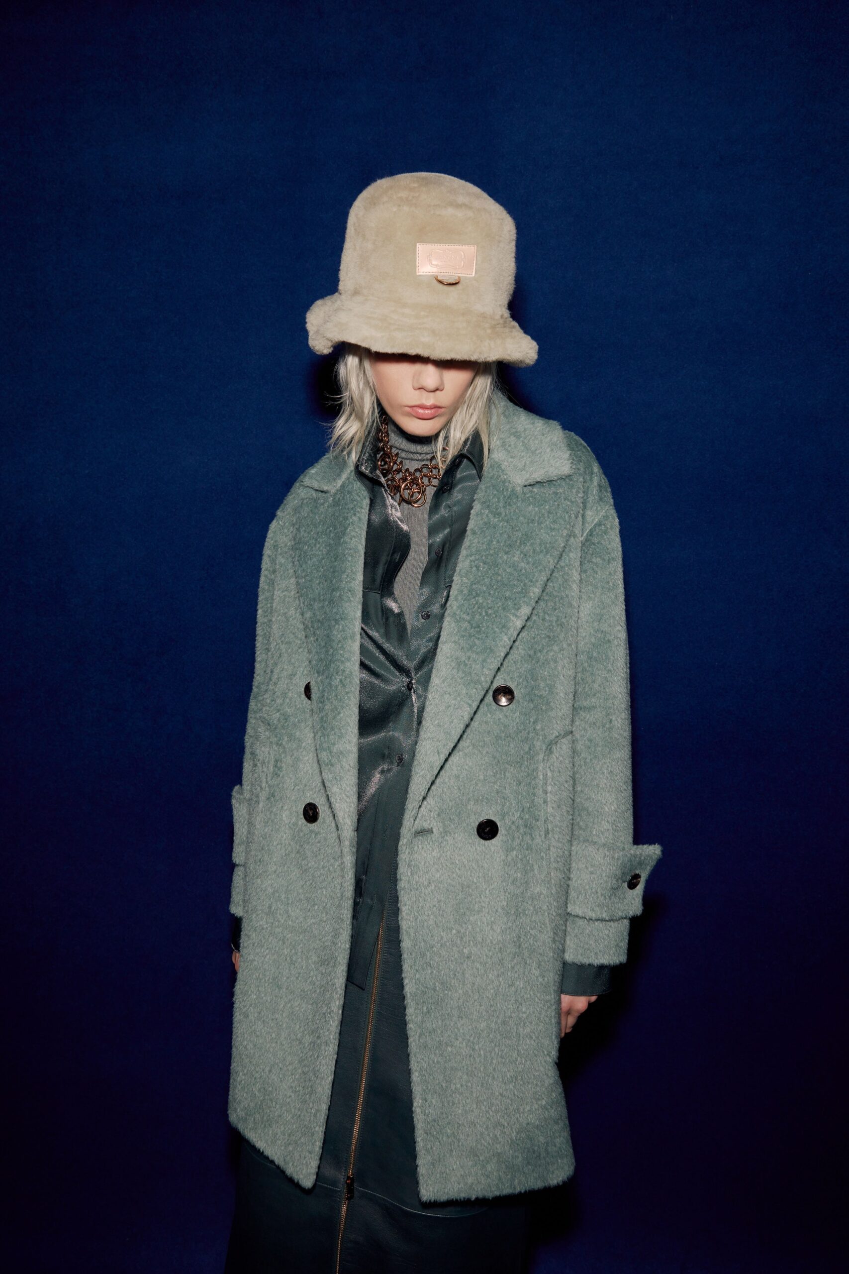 green wool coat with black dress