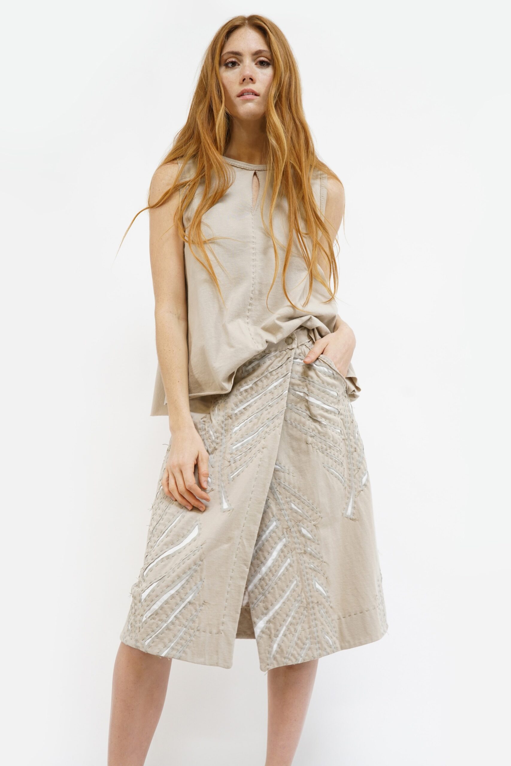 beige relaxed top with asymmetric skirt