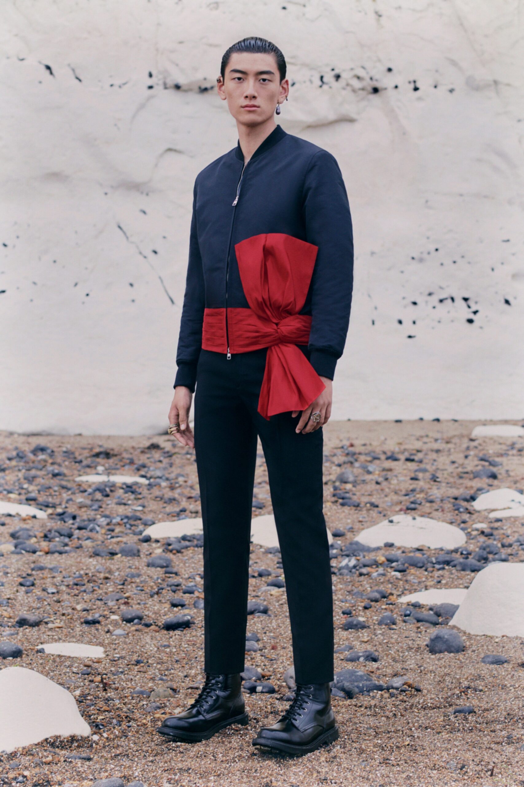 black fitted jacket with red belt
