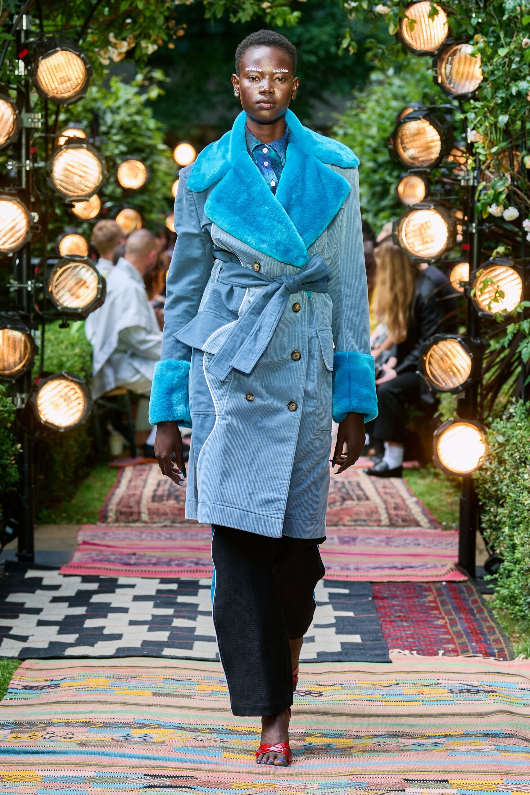 blue denim coat with black pants