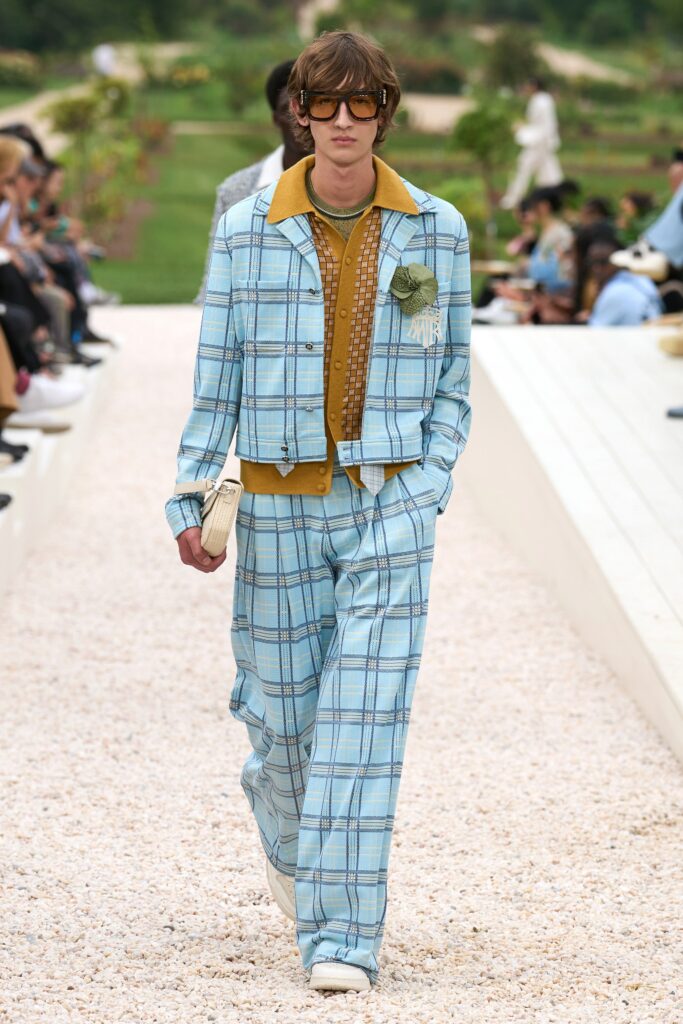 A relaxed fit blue checked jacket paired with matching pants, featuring a collared neckline.
