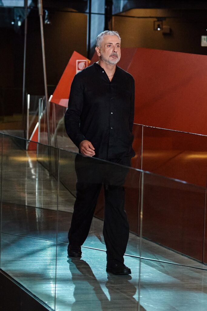A relaxed black long-sleeve collared shirt paired with matching pants.