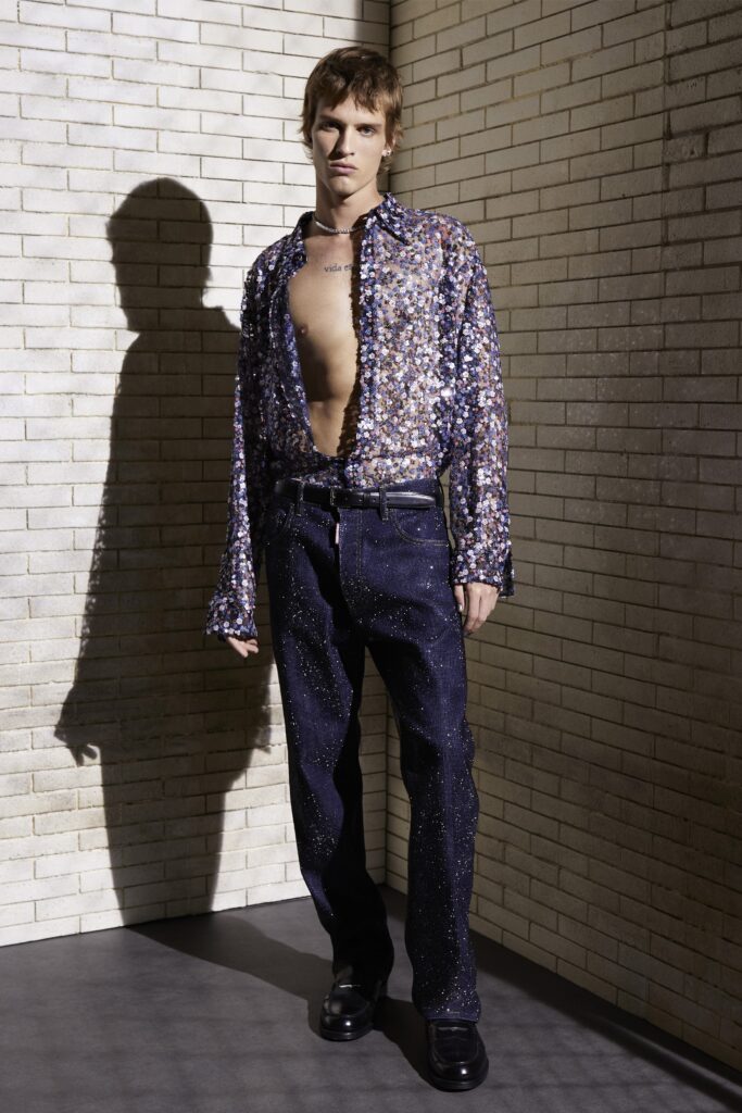 A relaxed blue denim long-sleeve shirt paired with casual pants.