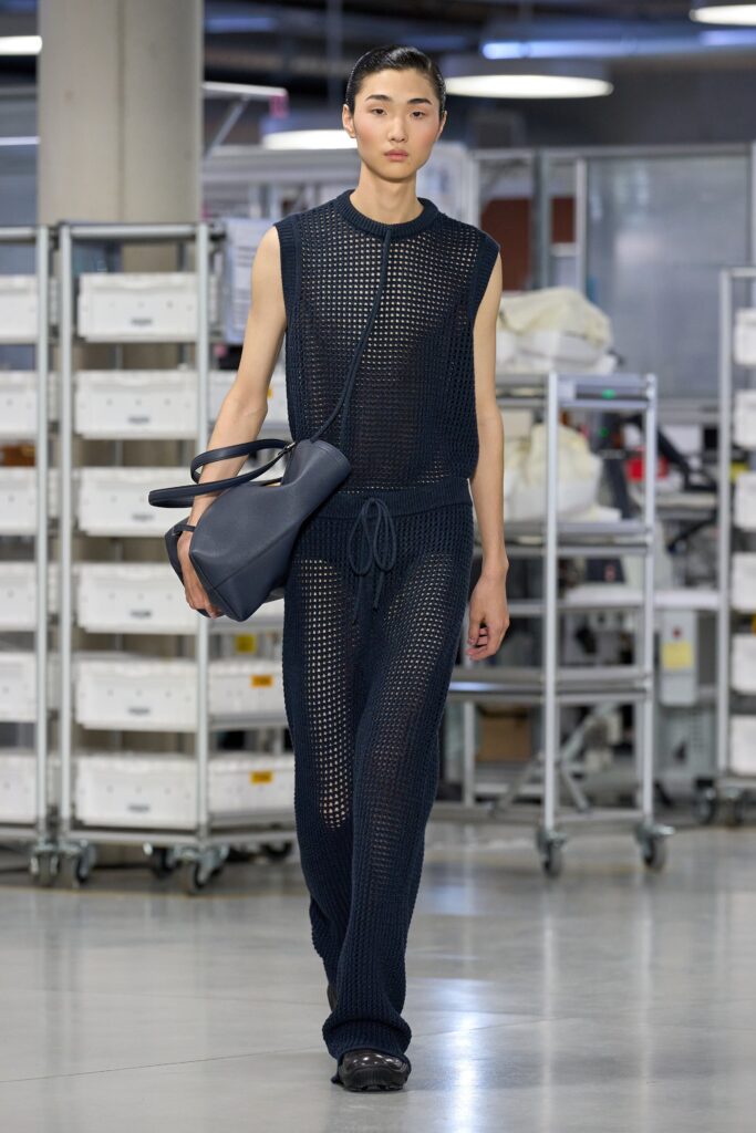 A relaxed blue knit sleeveless top paired with matching relaxed-fit pants.