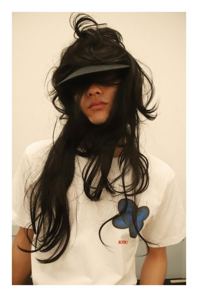 A casual white cotton t-shirt with a butterfly graphic and short sleeves.