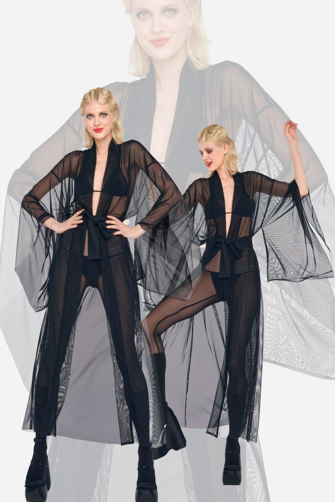 A relaxed black sheer dress coat with a V-neckline and layered design.