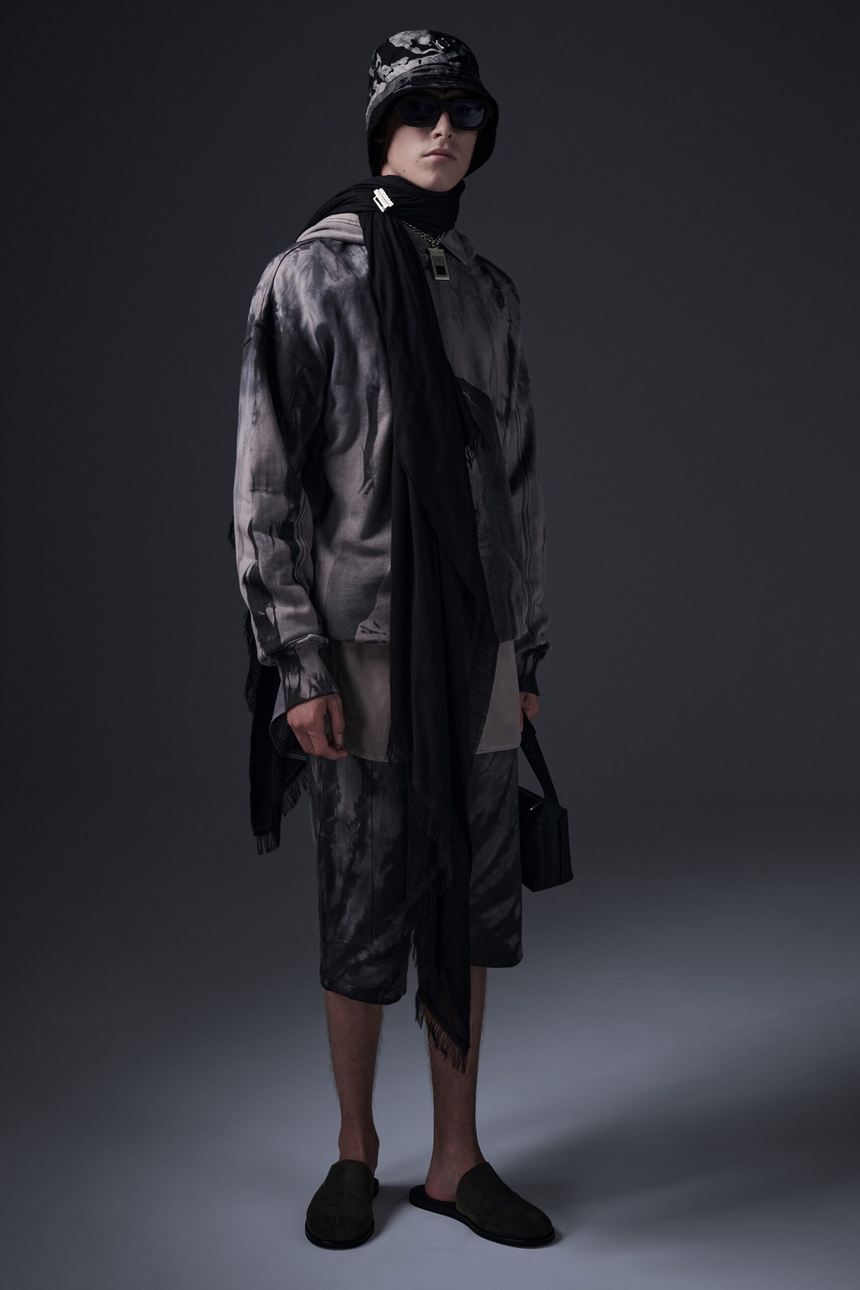 A relaxed fit black and gray printed jacket paired with matching shorts.