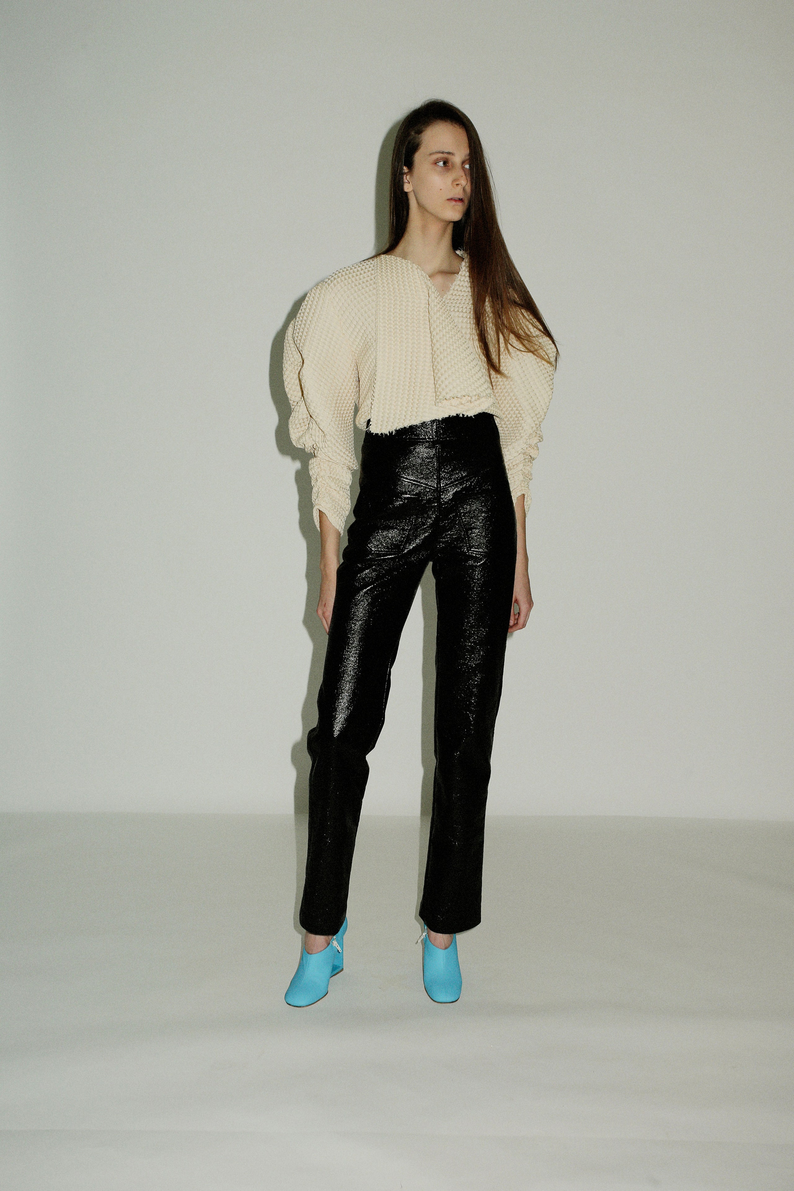 white relaxed top with black pants