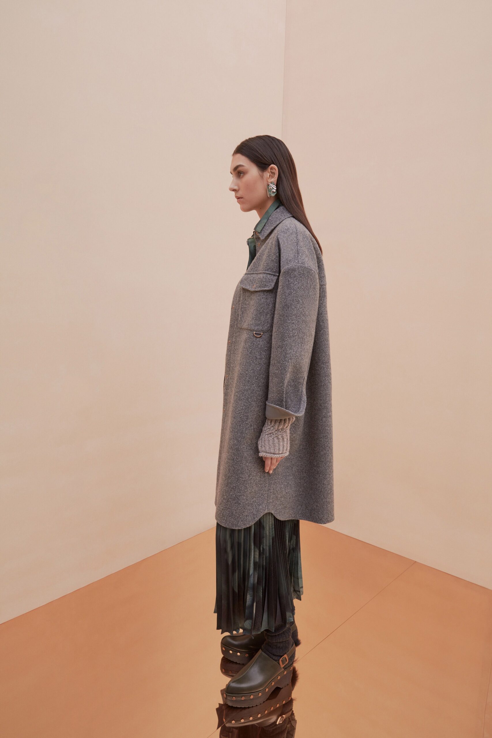 gray wool coat with green pleated dress